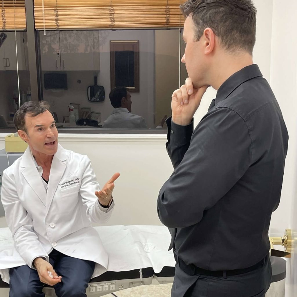 Dr Stephen Lowe in clinical discussion with Dr Patrick Bitter on laser and light-based treatments